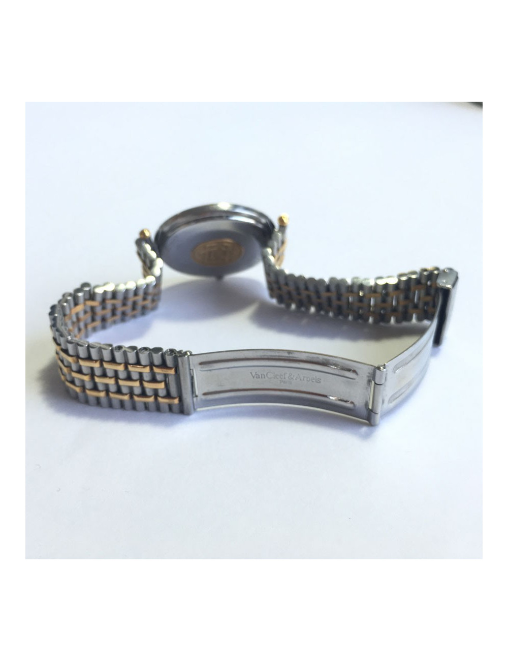 Shows VAN CLEEF & ARPELS man in steel and gold