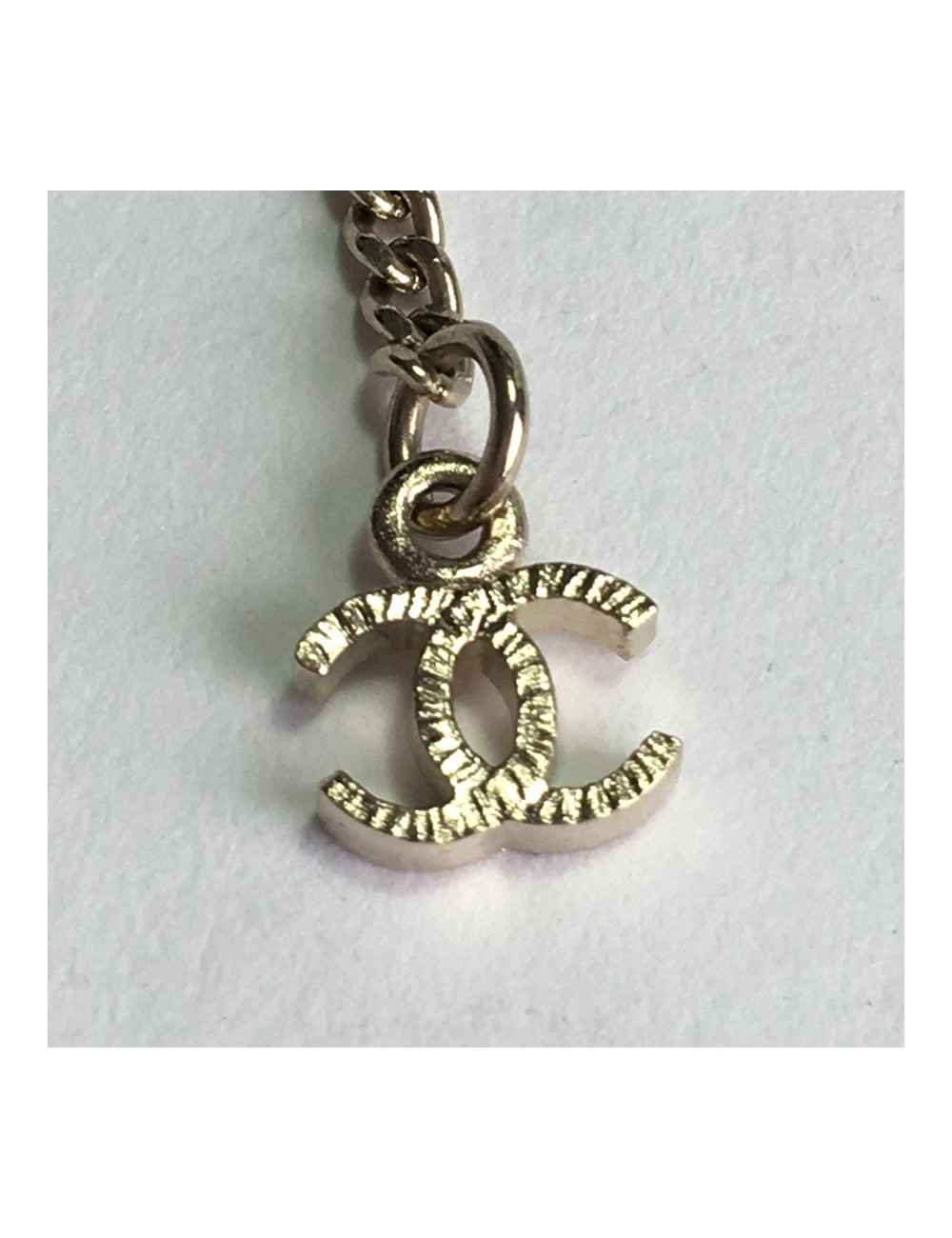 CHANEL necklace in gilt metal, CC pendant set with brilliants