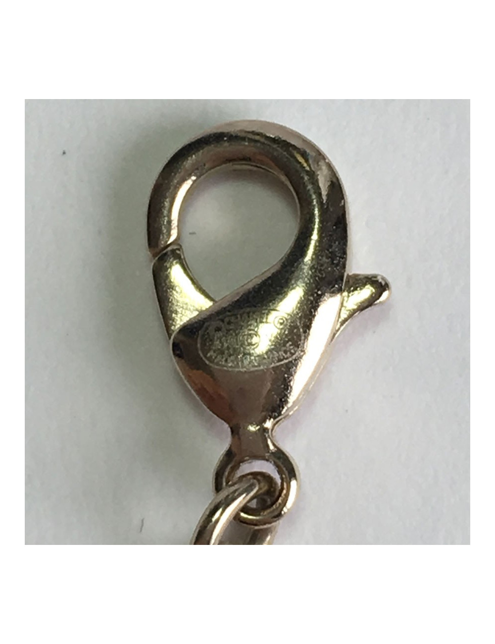 Collier CHANEL pendentif CC en strass et métal doré 