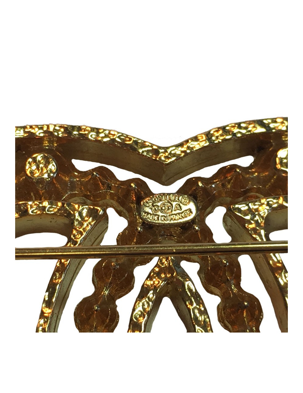 Broche CHANEL en métal doré et strass