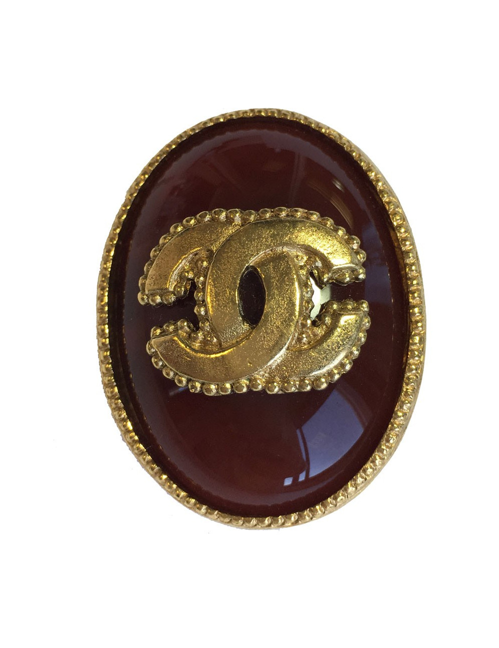 Broche CHANEL ovale en métal doré et pierre semi-précieuse de couleur ambre