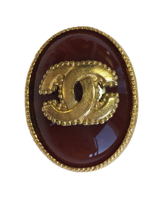 Broche CHANEL ovale en métal doré et pierre semi-précieuse de couleur ambre