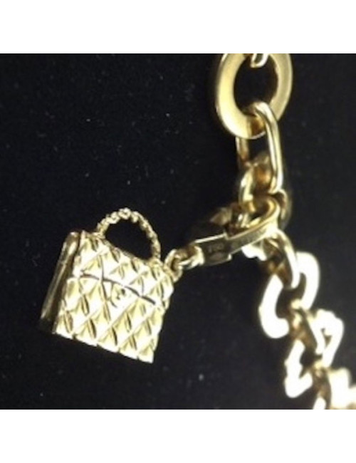 Collier CHANEL en or jaune et charms 