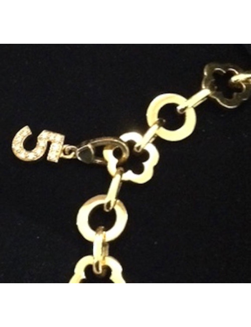 Collier CHANEL en or jaune et charms 