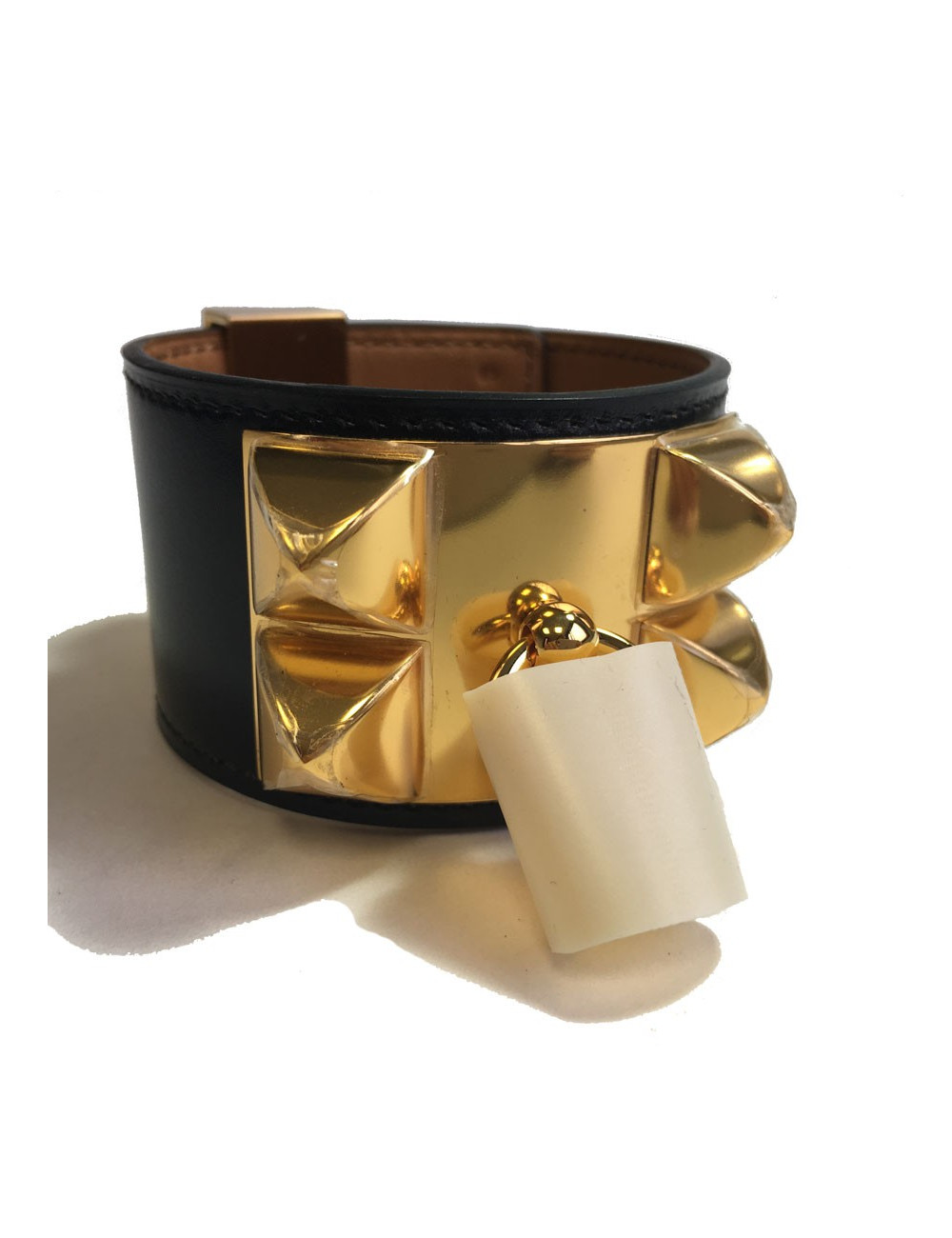 Manchette MEDOR HERMES en cuir box veau noir et bijouterie laiton plaqué or