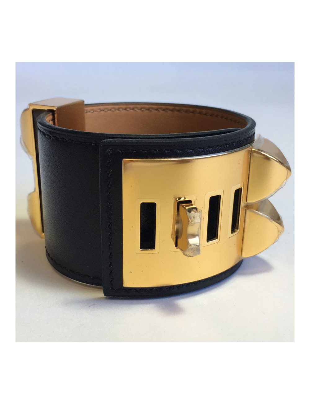 Manchette MEDOR HERMES en veau box noir et laiton plaqué or