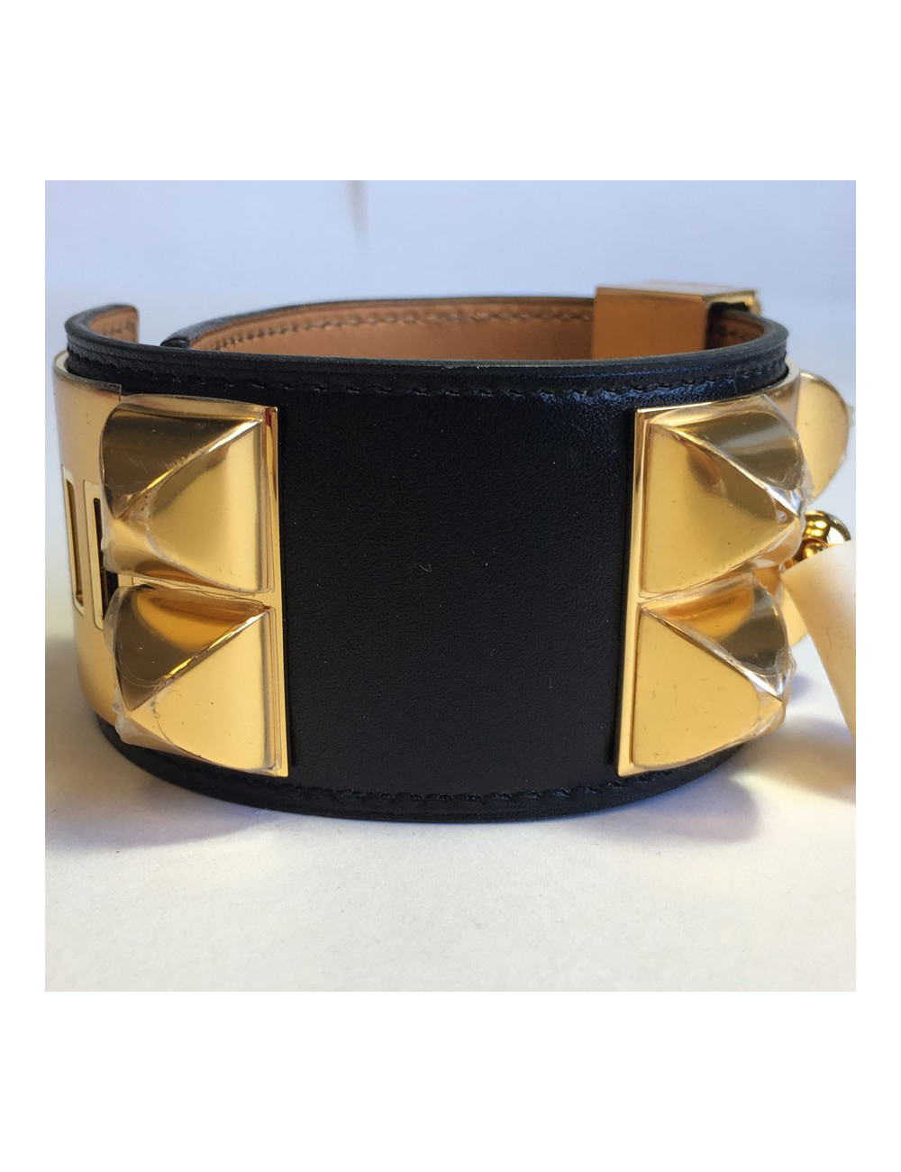 Manchette MEDOR HERMES en veau box noir et laiton plaqué or