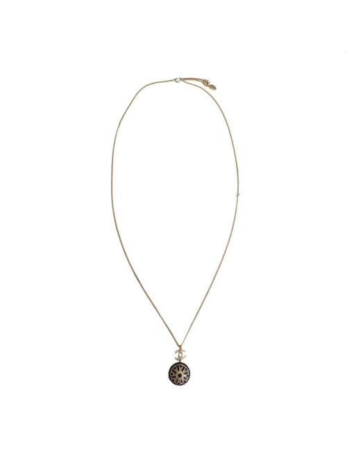 Collier CHANEL en métal doré,  pendentif  serti de petites perles noires
