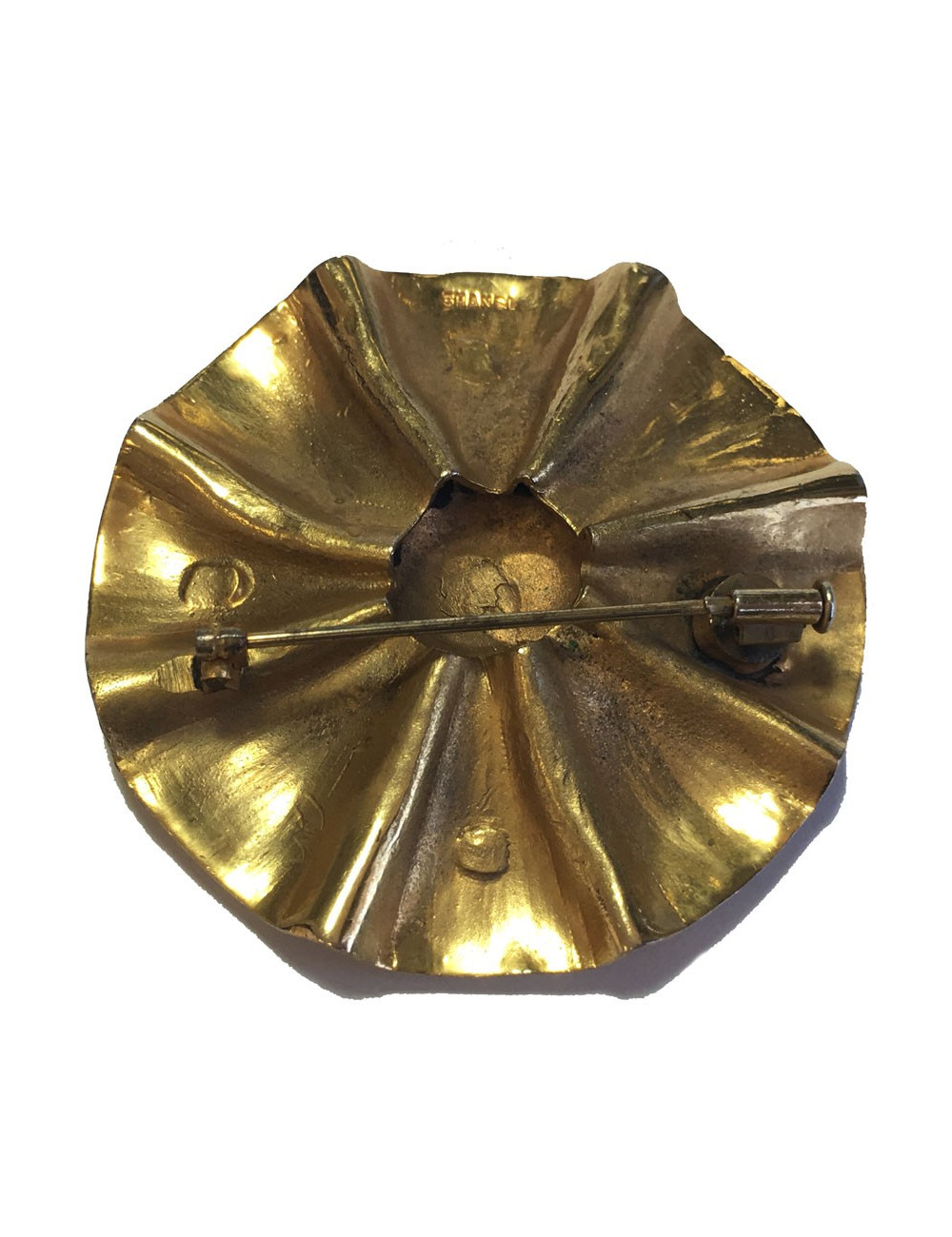 Broche CHANEL Vintage ronde en laiton doré
