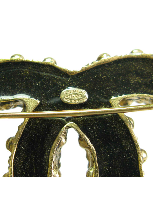 Broche CHANEL CC en métal doré vieilli