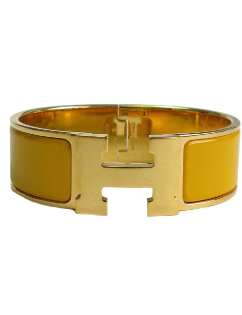 Bracelet Clic Clac HERMES en émail jaune, plaqué or