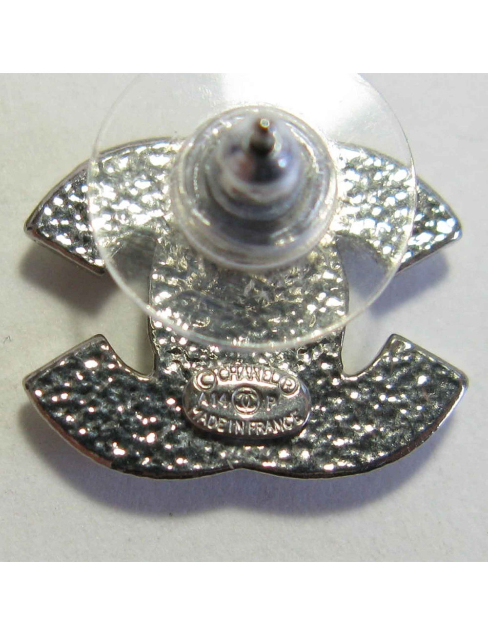 Boucles d'oreille clous CHANEL CC strass et métal argenté