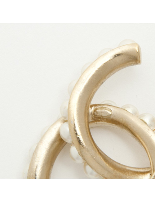 CHANEL CC Brooch in pale gilded metal fully beaded with pearls