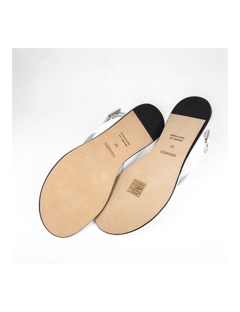 Sandales HERMES plate en cuir blanc H perforé