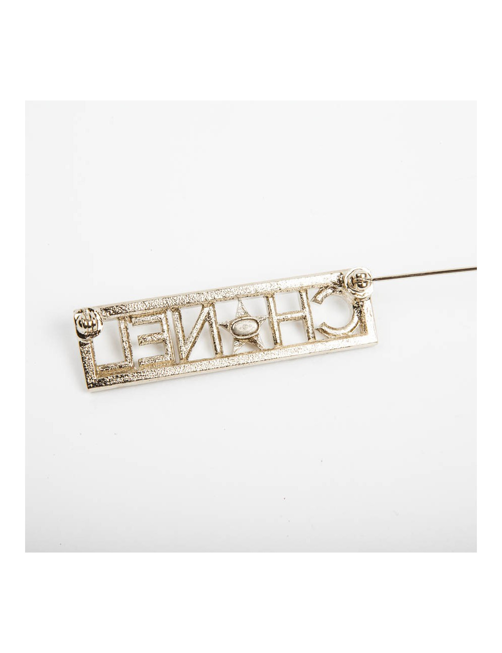 Broche "Paris-Dallas" avec strass