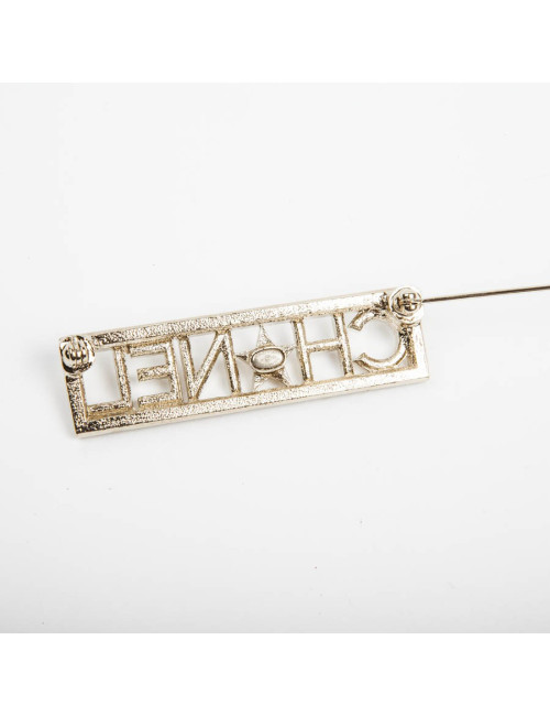 Broche "Paris-Dallas" avec strass