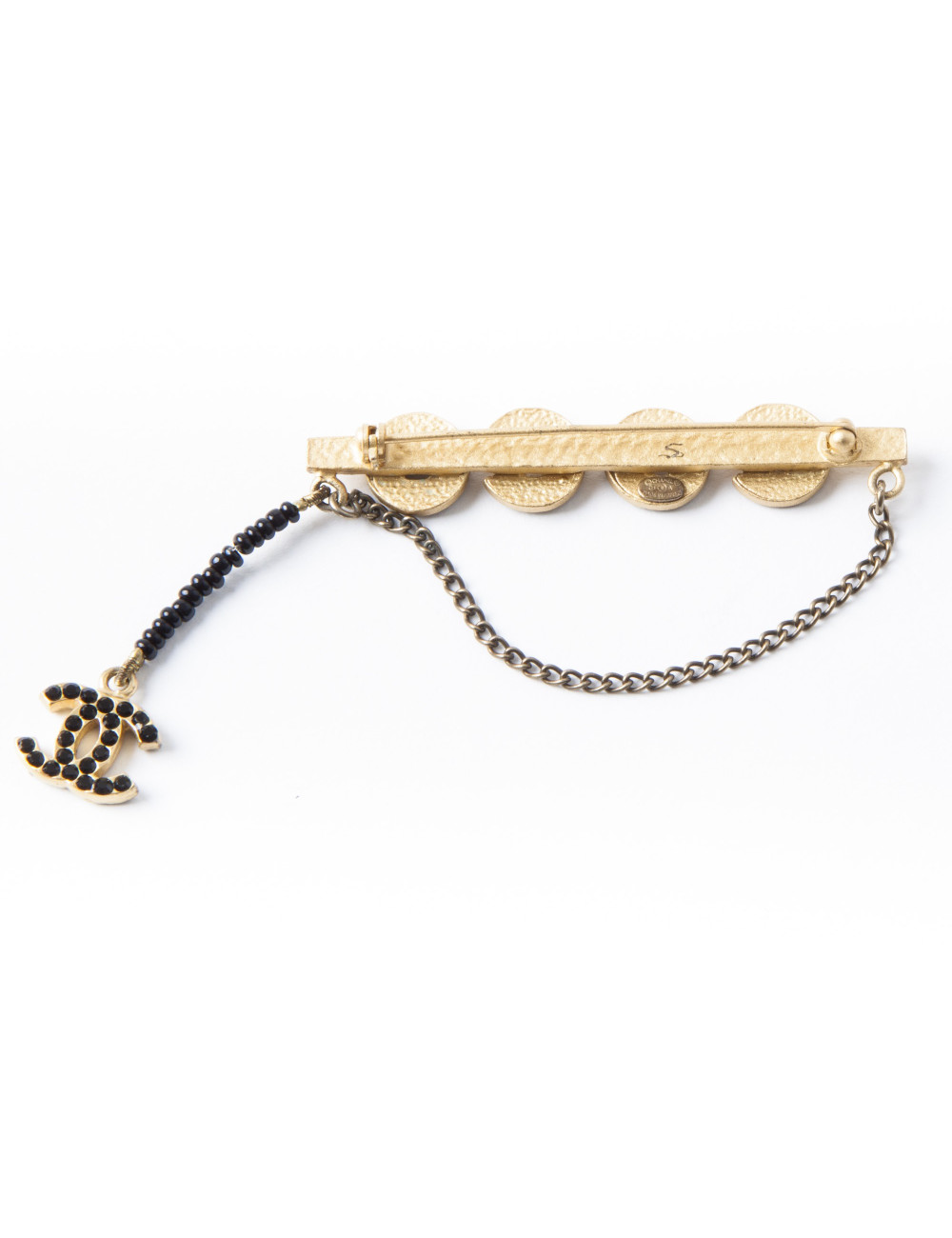  CHANEL 'COCO' brooch in matt gilded metal and black rhinestones