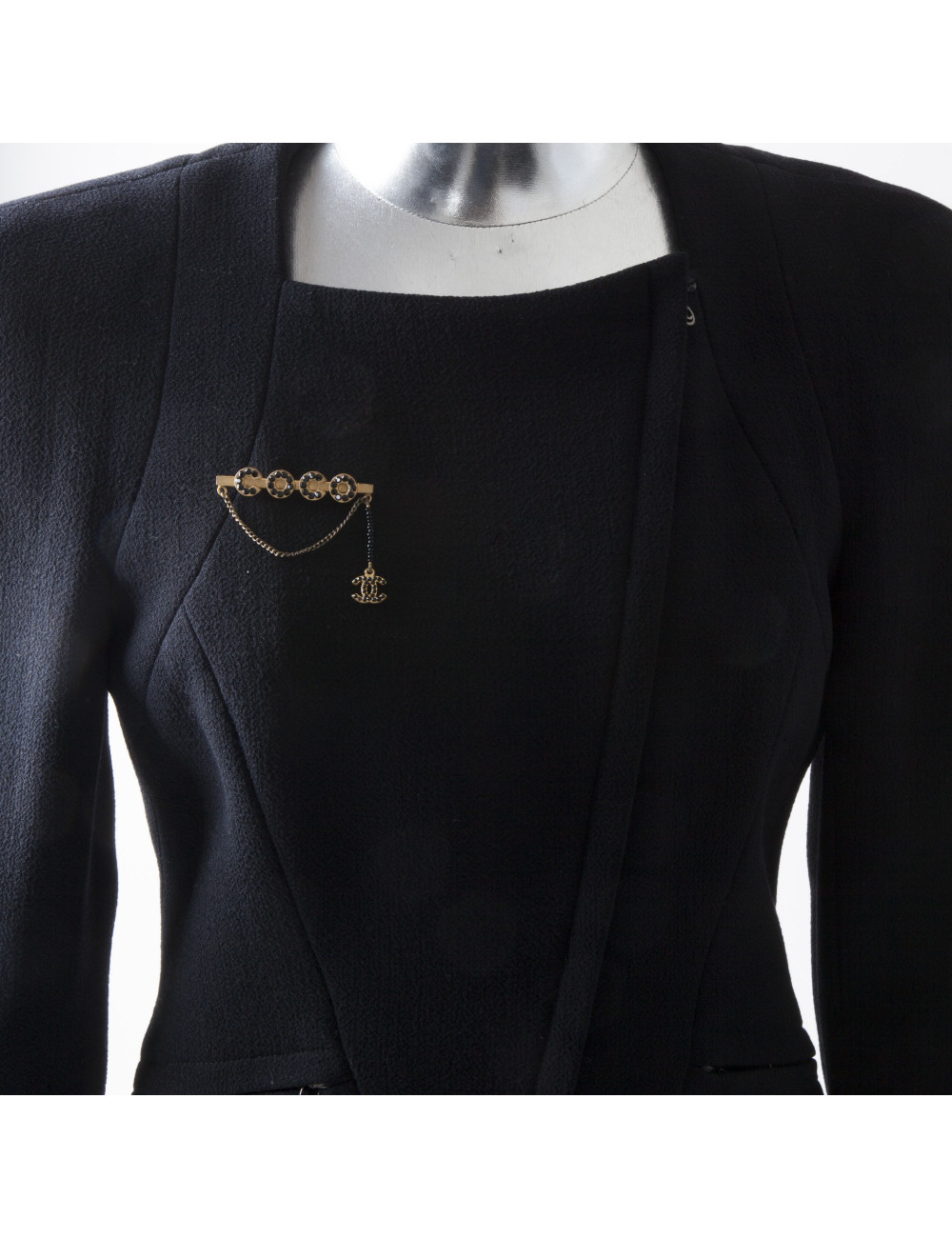  CHANEL 'COCO' brooch in matt gilded metal and black rhinestones