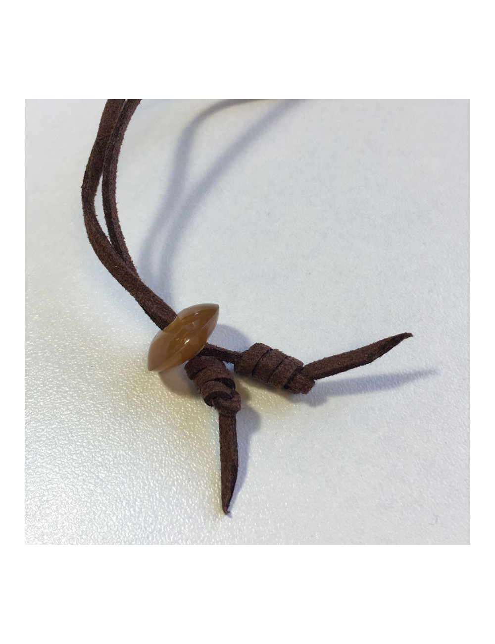 Pendentif H HERMÈS en bois laqué orange et corne de buffle