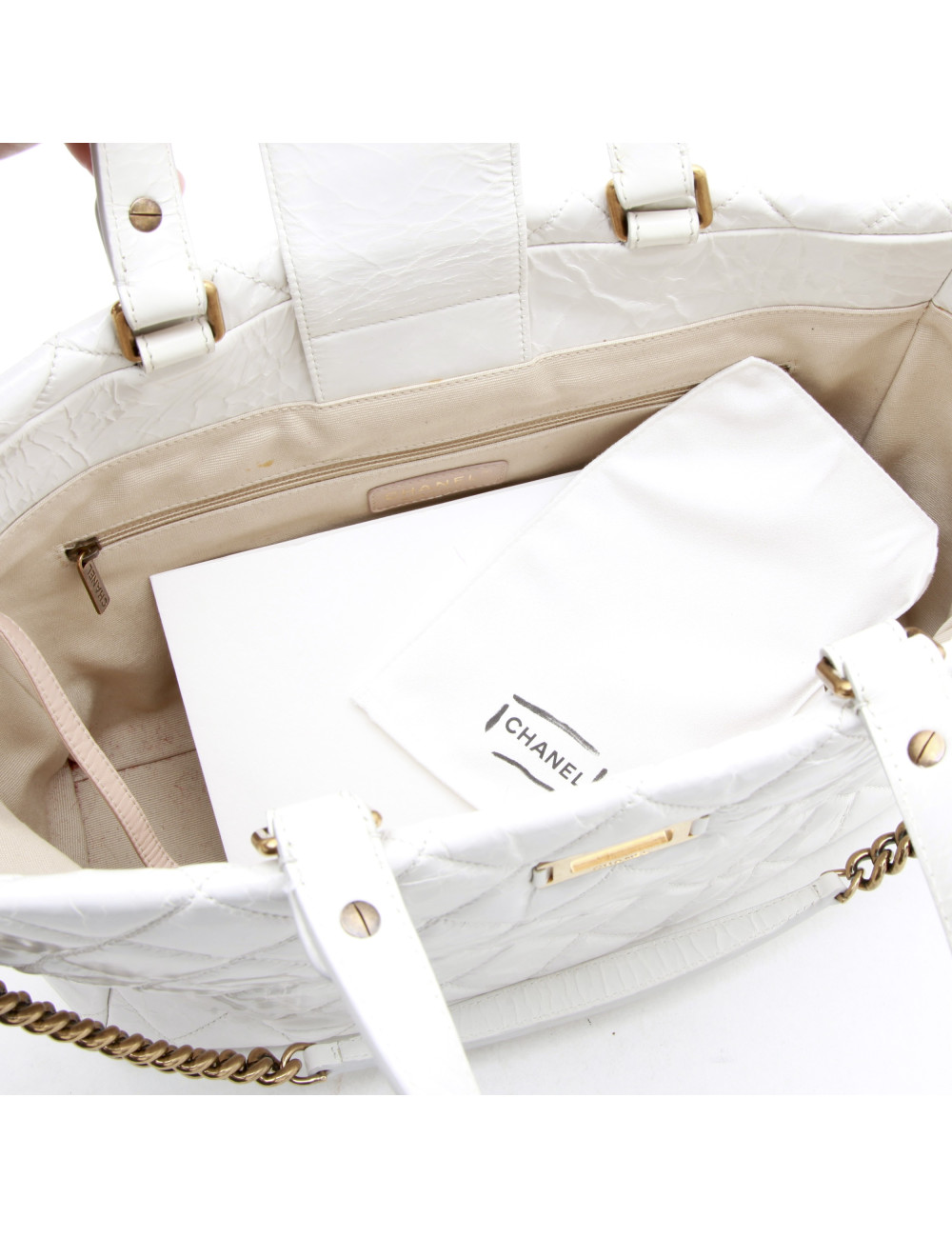 CHANEL tote bag in aged white patent leather