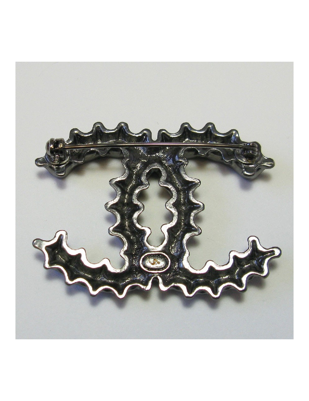 CHANEL CC bottle cap brooch in ruthenium