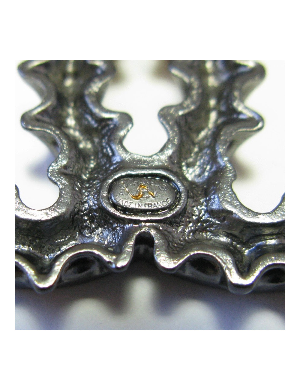 CHANEL CC bottle cap brooch in ruthenium