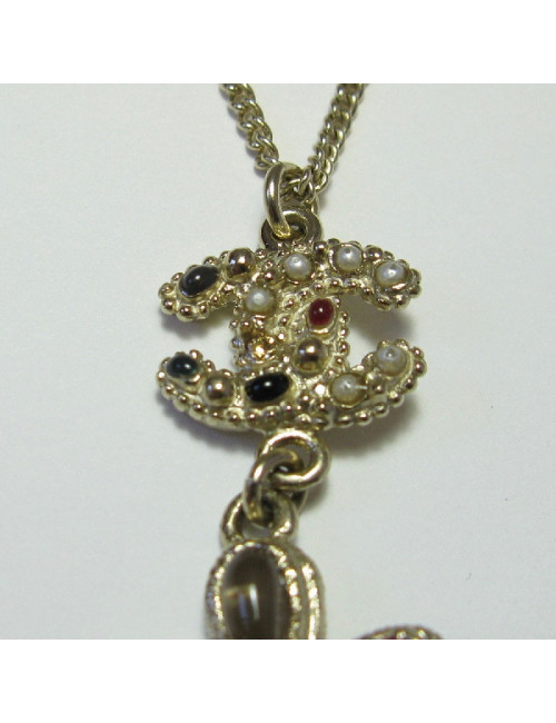 CHANEL pendant necklace in gilded metal and molten glass