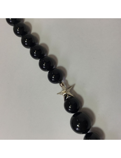 CHANEL Long necklace in black pearls, golden CC and stars