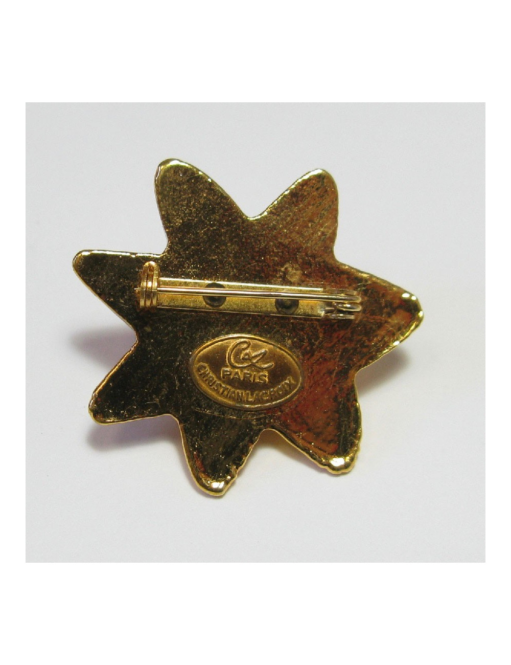 Broche CHRISTIAN LACROIX soleil en résine dorée vintage