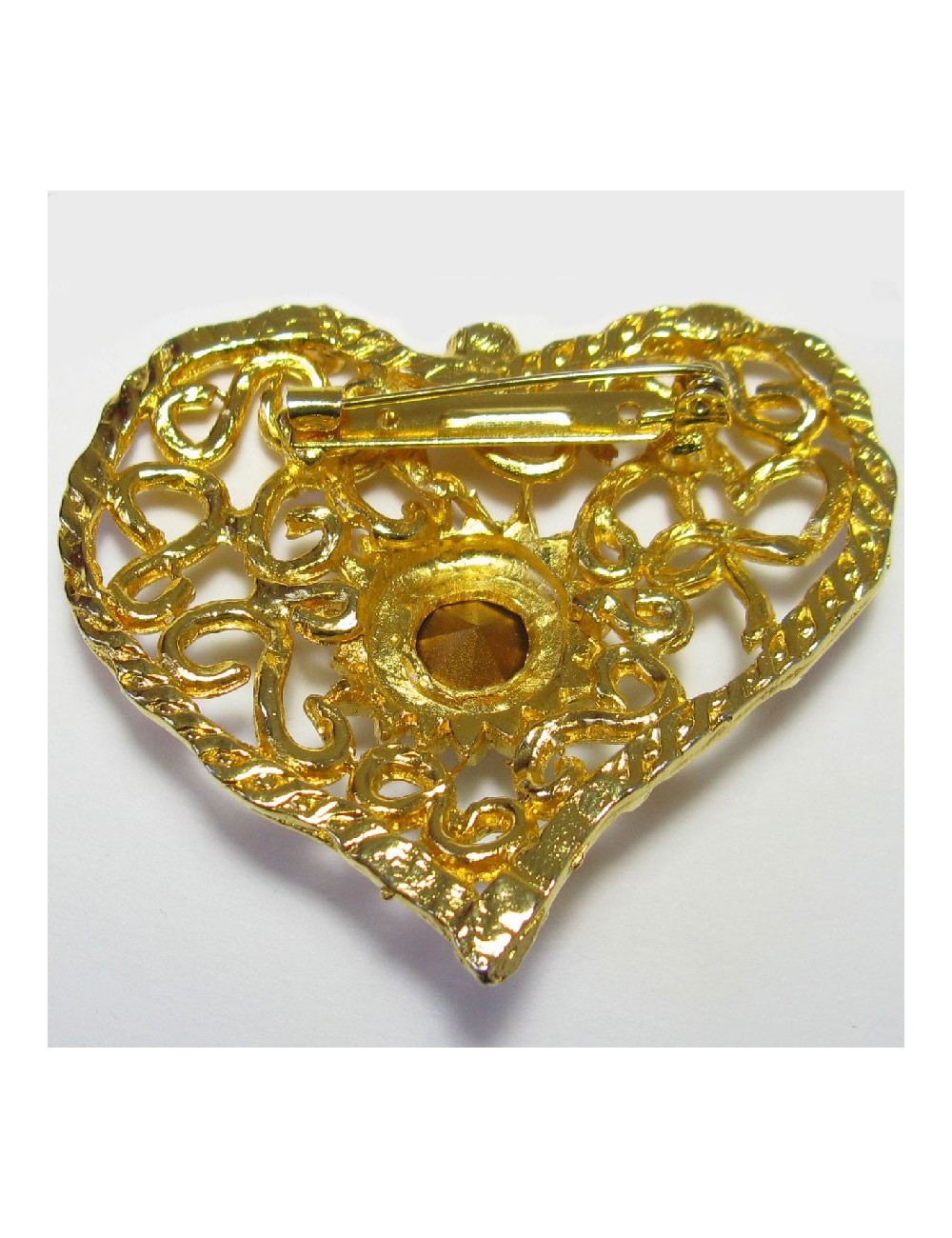 Broche CHRISTIAN LACROIX vintage coeur en métal doré serti d'un grand strass blanc au centre