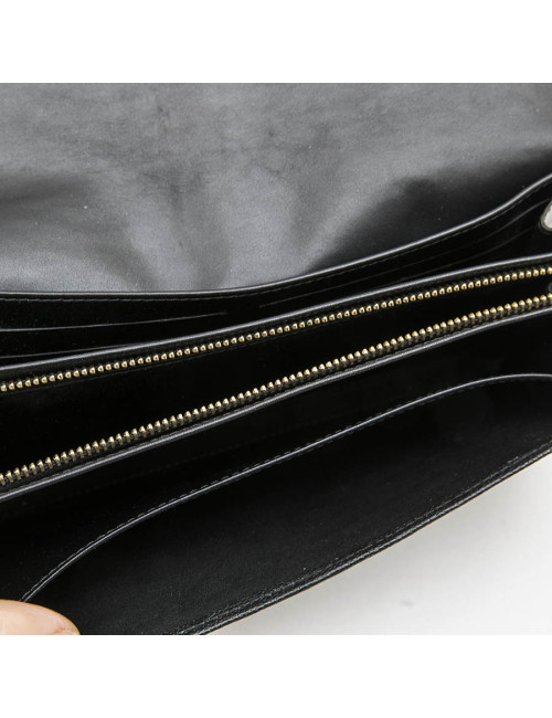 LOUIS VUITTON clutch in black grained leather with saddle stitching