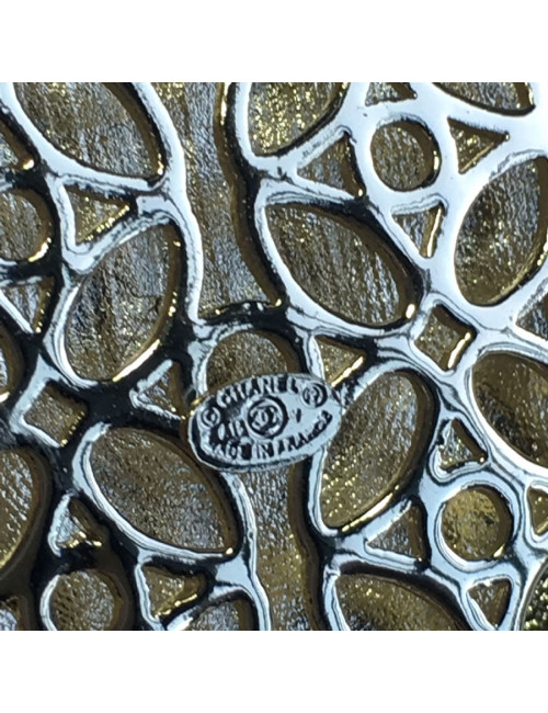 CHANEL escutcheon brooch in pale gilded metal, pearls and colored resin