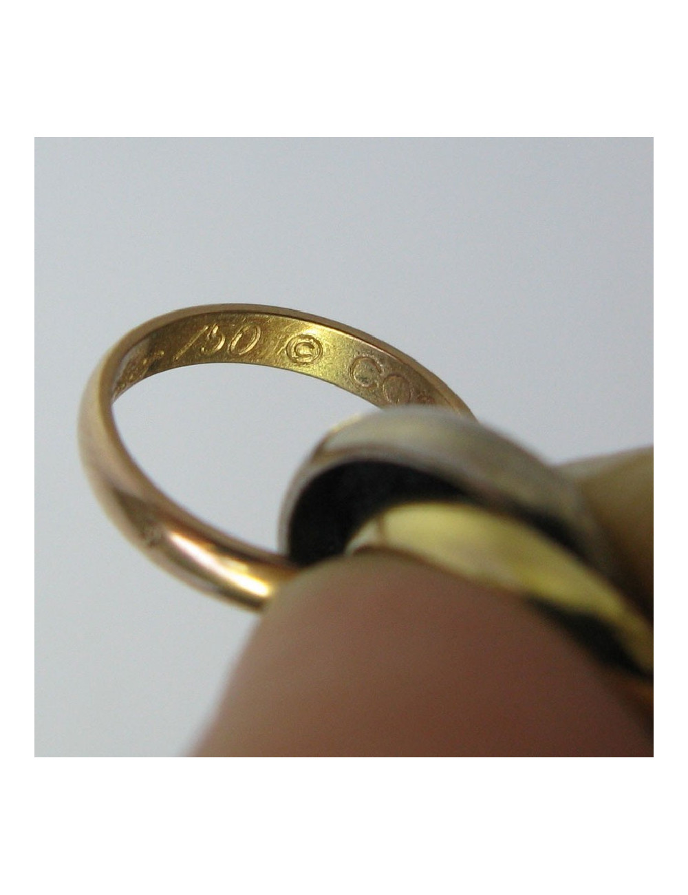 Bracelet CARTIER 'Trinity' cordon et anneaux 3 ors