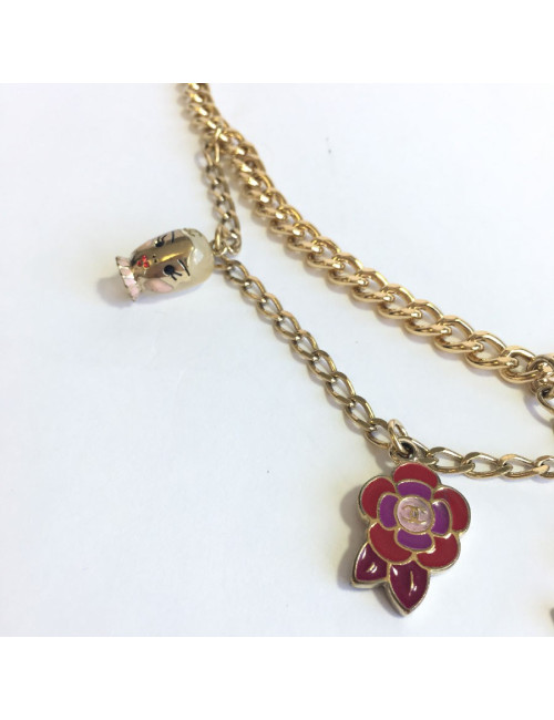 CHANEL "Paris-Shanghai"long necklace belt in gilt metal and charms