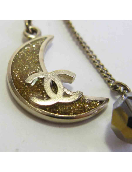Boucles d'oreille clous CHANEL pendantes étoile et lune en métal doré