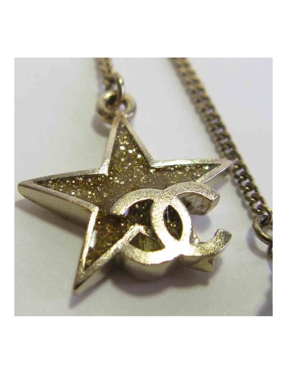 Boucles d'oreille clous CHANEL pendantes étoile et lune en métal doré