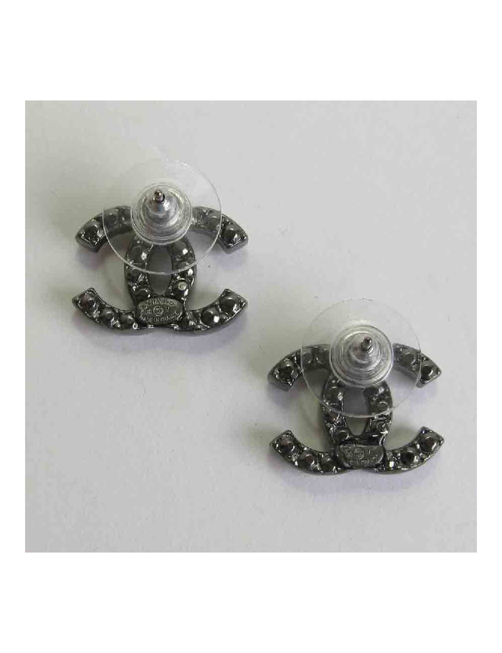 CHANEL "CC" stud earrings in ruthénium and rhinestones