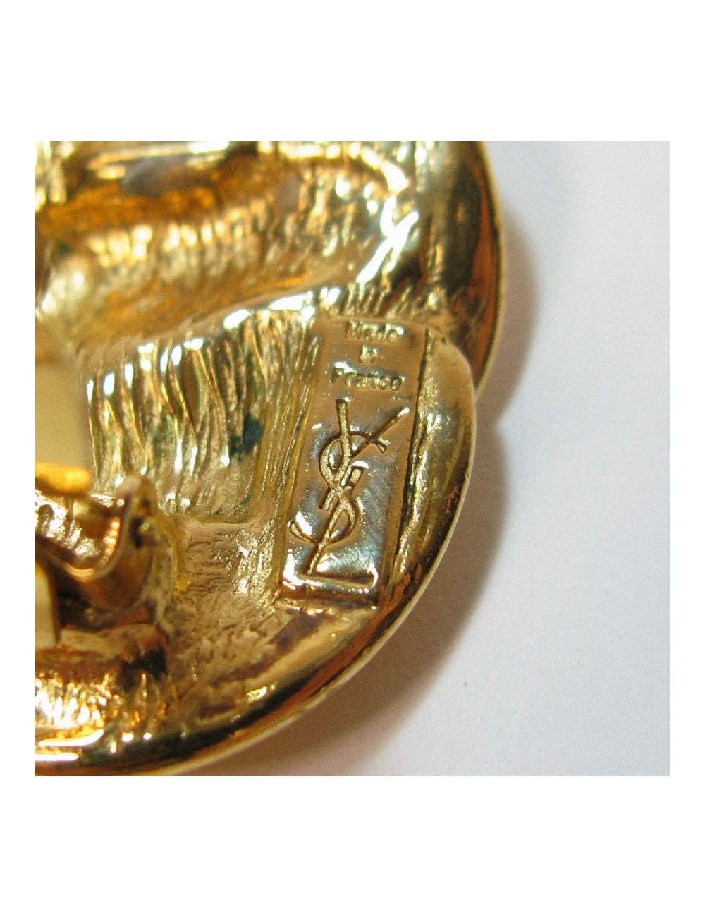 Boucles d'oreilles clips YVES SAINT LAURENT vintage en métal doré