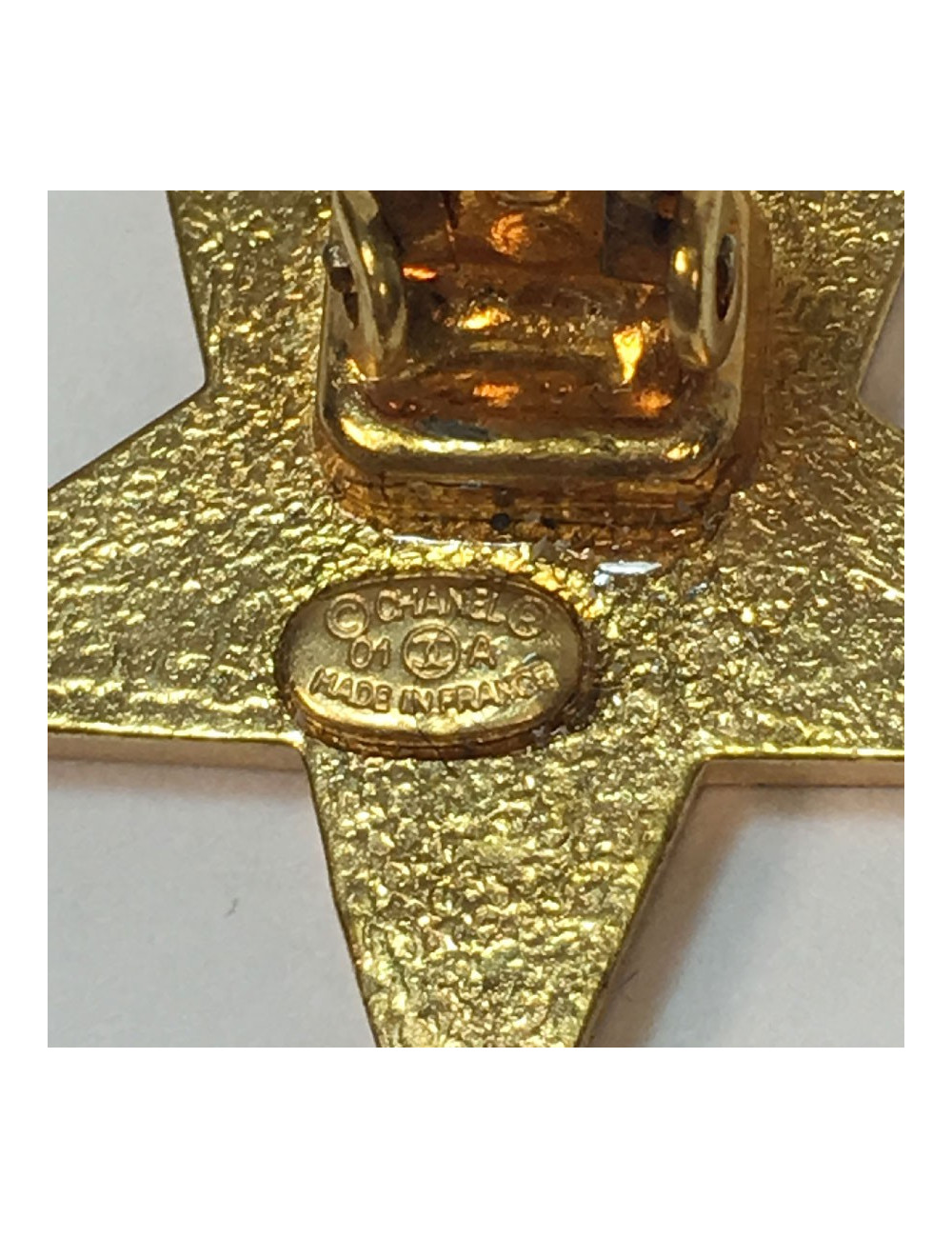 CHANEL star clip-on earrings in gilt metal and ivory resin