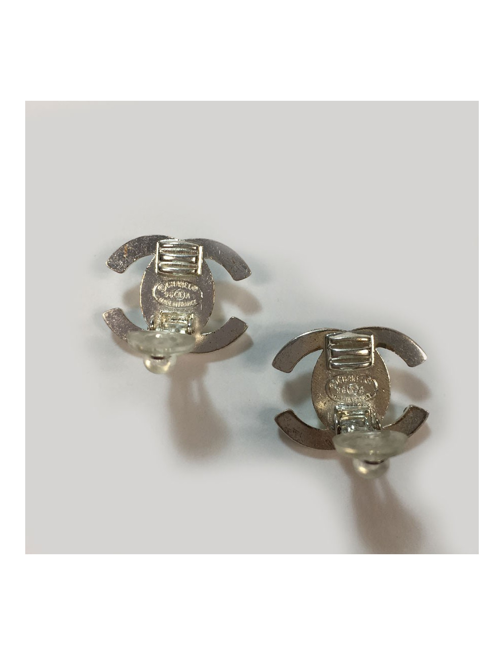CHANEL vintage CC clip-on earrings in silver metal and rhinestones