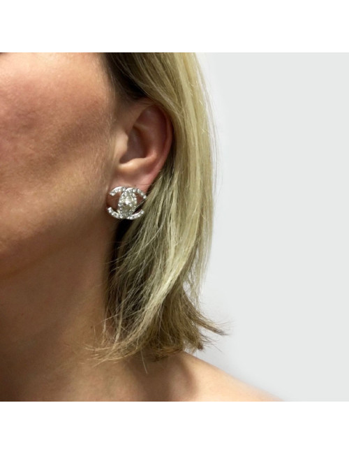 Boucles d'oreille Clips CHANEL CC strass et métal argenté