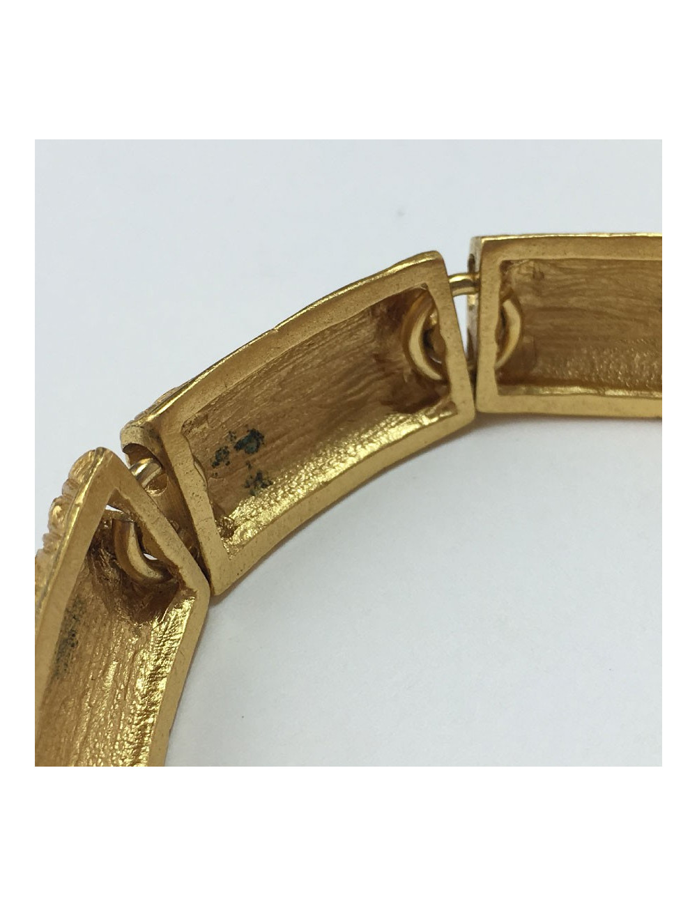 YVES SAINT LAURENT rigid bracelet in gilt metal