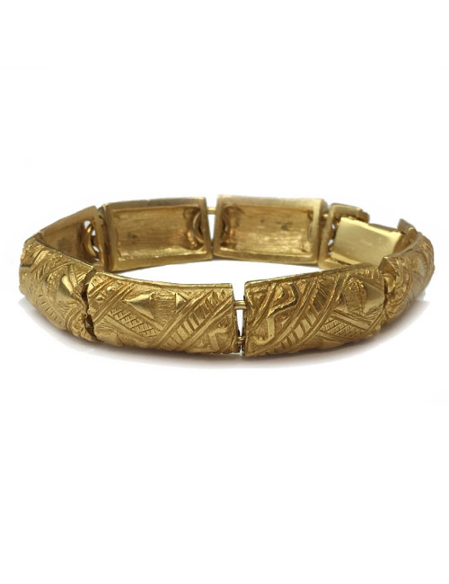 YVES SAINT LAURENT rigid bracelet in gilt metal