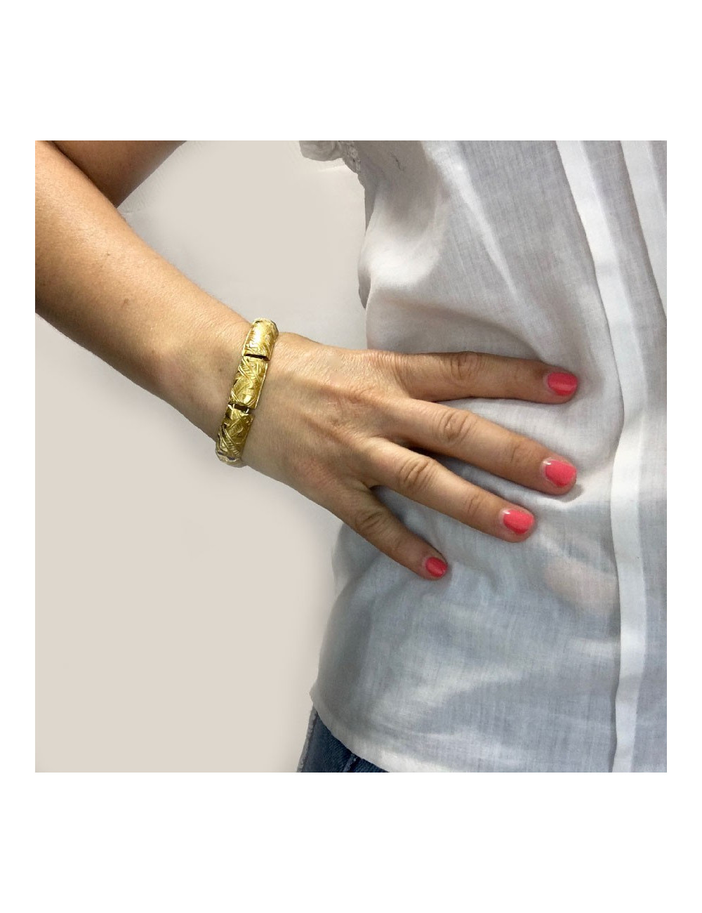 YVES SAINT LAURENT rigid bracelet in gilt metal