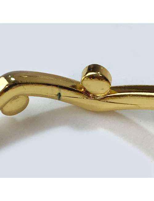 Bracelet rigide YVES SAINT LAURENT métal doré et strass rubis et améthyste