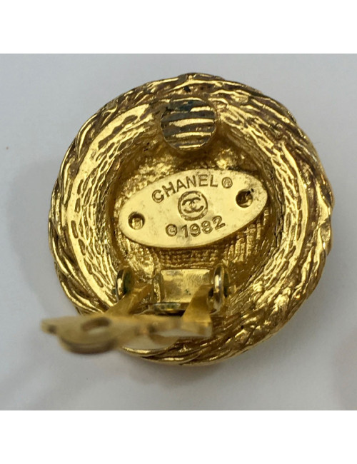 Boucles d'oreille clips CHANEL tête de lion et strass