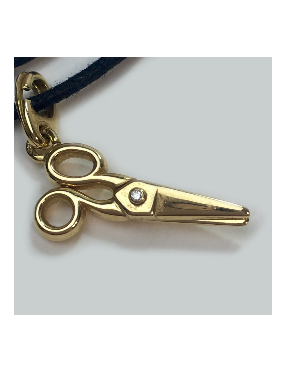 DIOR necklace with a scissors charm in gold and small diamond