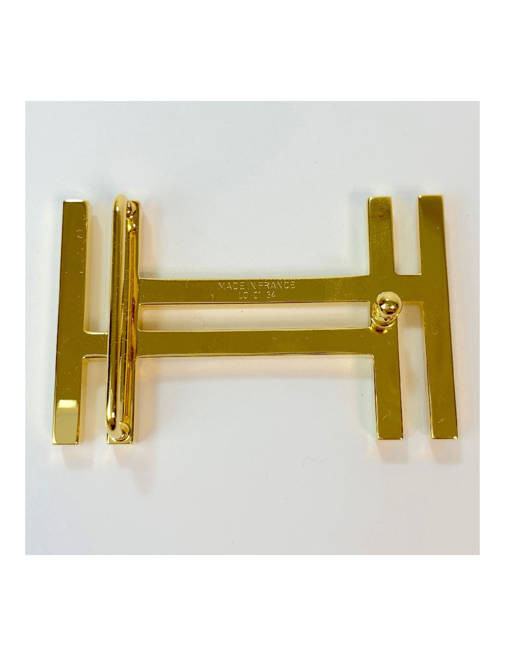 Boucle de ceinture HERMES H en métal doré brillant et mat