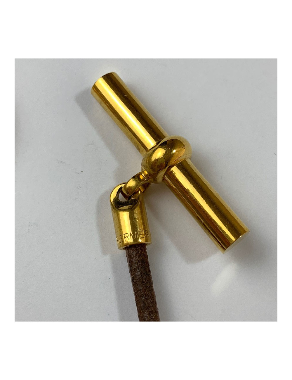 Collier HERMES cordon  et boucle dorée