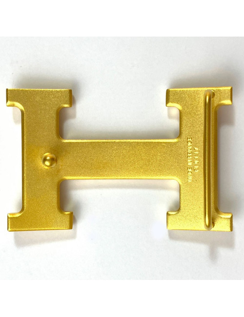 Boucle H HERMES en métal doré mat